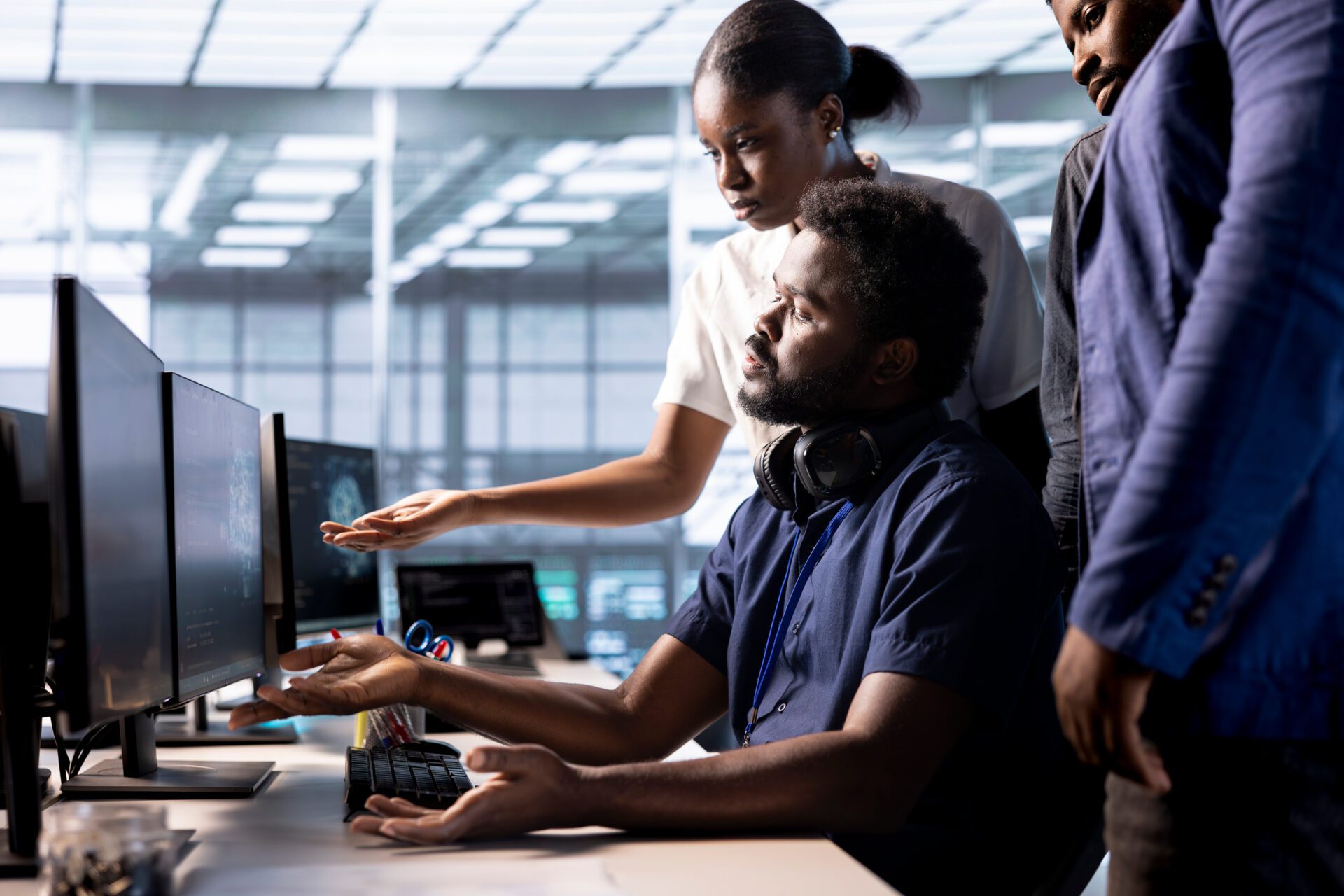 IT professionals in a modern office, discussing managed services and cybersecurity solutions.